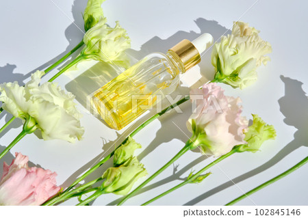 Serum with yellow petals and delicate flowers. Serum with yellow petals and delicate flowers. 102845146