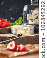 gourmet goat cheese with mold and soft liquid core  102845292