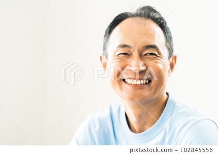 Portrait of a smiling middle-aged man 102845556