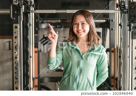 smiling asian woman in gym 102846840