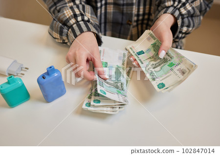 Russian rubles in the hand of a fan.male hand holding many of the Russian banknotes.The transfer of money.The isolated five-thousandth of Russian rubles denominations in a hand. 102847014