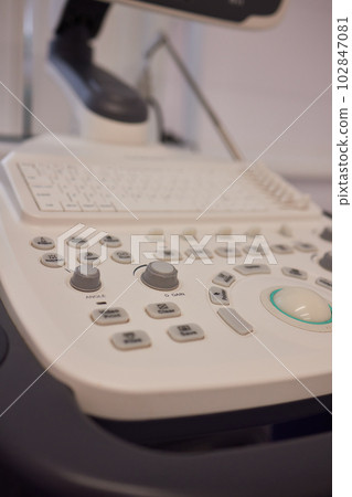 ultrasound machine doctor's hand usg investigation. ultrasound machine doctor's hand usg investigation. 102847081