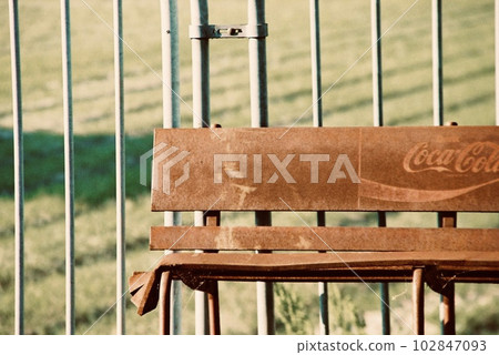 Battered Coca-Cola bench 102847093