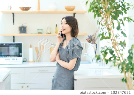 Young woman making a phone call Young woman making a phone call 102847651
