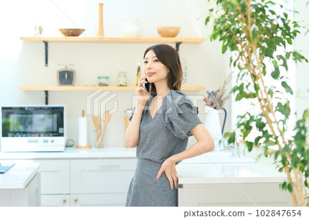 Young woman making a phone call Young woman making a phone call 102847654