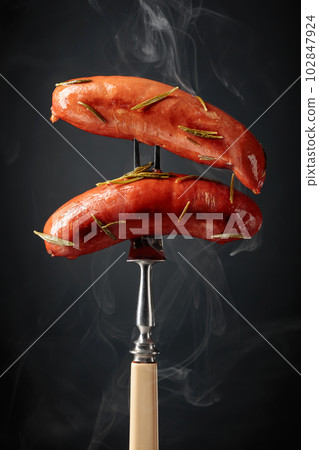 Roasted Bavarian sausages with rosemary. Roasted Bavarian sausages with rosemary. 102847924