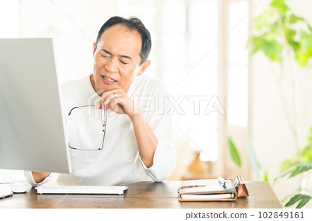 Remote work businessman worried about PC Remote work businessman worried about PC 102849161