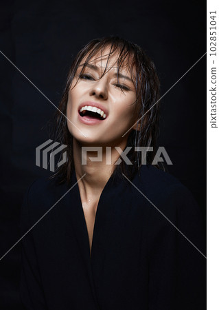 Happy smiling young woman with Wet Hair 102851041