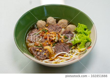 Thai Noodle beef is very delicious on table with vegetable Thai Noodle beef is very delicious on table with vegetable 102851666