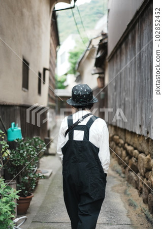 A woman strolling with the old streets of Tomonoura A woman strolling with the old streets of Tomonoura 102852452