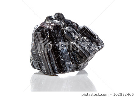 macro mineral stone sherle, schorl, black tourmaline on white background 102852466