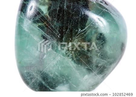 Macro mineral stone Fluorite crystal on a black background 102852469