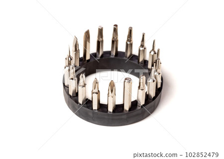 A set of different attachments for a head screwdriver with a screwdriver on a white background A set of different attachments for a head screwdriver with a screwdriver on a white background 102852479