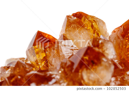 Macro mineral stone Citrine in rock in crystals on a white background Macro mineral stone Citrine in rock in crystals on a white background 102852503