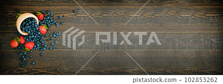 Fresh Berries on Rustic Wooden Background 102853262