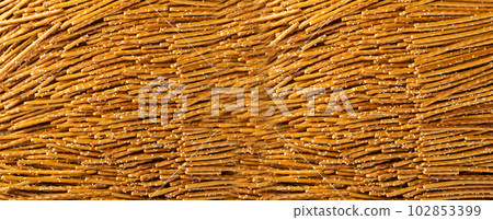 Pretzel Sticks Texture Background, Crunchy Breadsticks Pattern with Copy Space, Grissini Banner 102853399