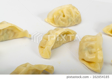 Gyoza Chinese Dumplings on WHite, Vegetable Jiaozi, Chicken Momo Pile, Asian Gyoza Group Gyoza Chinese Dumplings on WHite, Vegetable Jiaozi, Chicken Momo Pile, Asian Gyoza Group 102854185