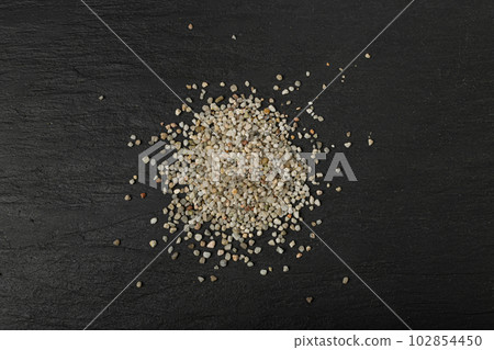 Crushed Quartz Pile, White Stone Pieces, Grit Sand, Decorative Rocks Texture on Black Background 102854450