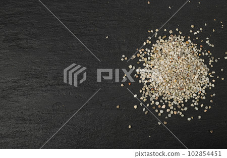 Crushed Quartz Pile, White Stone Pieces, Grit Sand, Decorative Rocks Texture on Black Background 102854451