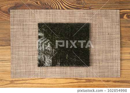 Nori Sheet, Dried Aonori Seaweed, Dry Sea Weed, Seaweed Sheets, Nori Seaweed Pieces Top View Nori Sheet, Dried Aonori Seaweed, Dry Sea Weed, Seaweed Sheets, Nori Seaweed Pieces Top View 102854998
