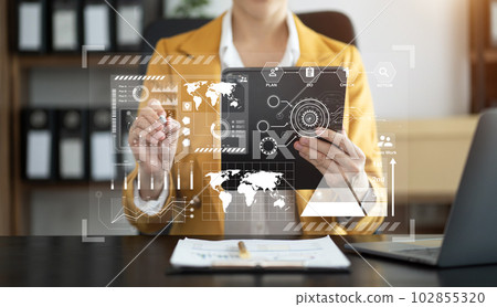 Businesswoman hand Project manager working and update tasks and Gantt chart scheduling virtual diagram.with smart phone, tablet and laptop in office. Businesswoman hand Project manager working and update tasks and Gantt chart scheduling virtual diagram.with smart phone, tablet and laptop in office. 102855320