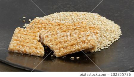 Sesame Snack, Honey Seed Cracker, Sesame Candy Bar on Black Background 102855786
