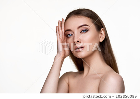 young woman with perfect skin on white background. 102856089