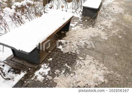 Wooden Bench in Snow, Frozen Winter Park, Outdoor City Architecture, Empty Plank Seat in Snowfall, Seasonal Travel Wooden Bench in Snow, Frozen Winter Park, Outdoor City Architecture, Empty Plank Seat in Snowfall, Seasonal Travel 102856167