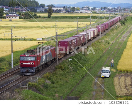 A freight train on the Tohoku Main Line running through the countryside A freight train on the Tohoku Main Line running through the countryside 102856531