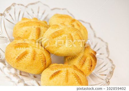 Traditional eid maamoul or mamoul cookies with dates, nuts, and jam, Arabic sweets for Aid al-Fitr 102859402