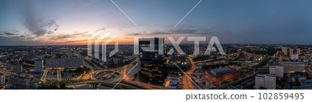 Aerial drone photo of Katowice centre with roundabout and modern office towers at evening. Aerial drone photo of Katowice centre with roundabout and modern office towers at evening. 102859495