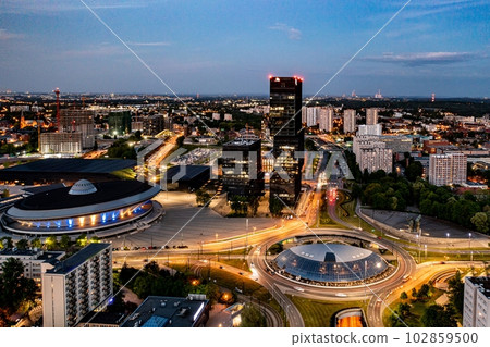 Aerial drone photo of Katowice centre with roundabout and modern office towers at evening. 102859500