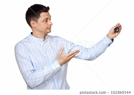 man holding car keys. Car dealerships offer car . man holding car keys. Car dealerships offer car . 102860544