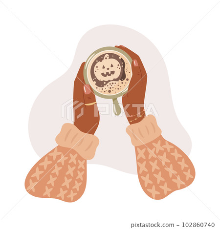 Latte Art Halloween Pumpkin design. Woman hands holds mug with coffee 102860740