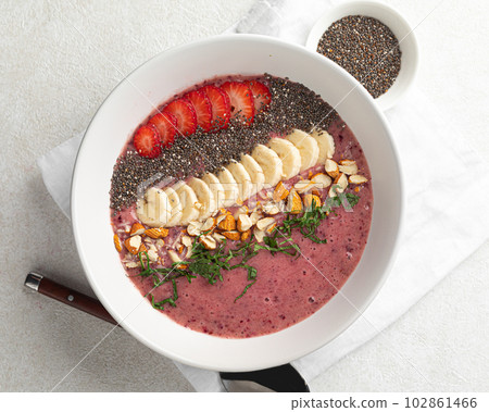 Healthy smoothie bowl with banana and strawberries Healthy smoothie bowl with banana and strawberries 102861466