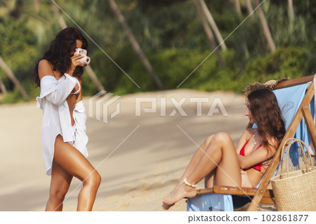 Photoshoot of Bikini Women Model on a Tropical Beach During Vacation 102861877