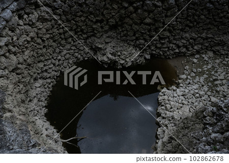 Deep brick wells, disused pumping wells, dark wells of coral, decaying masonry springs, 102862678