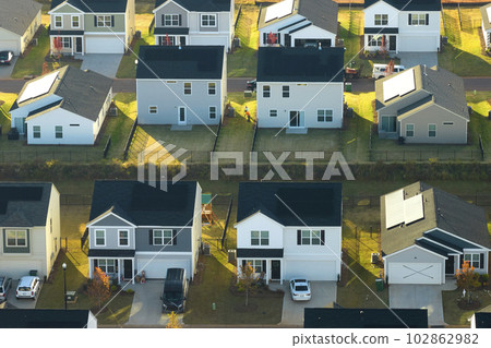 View from above of densely built residential houses in living area in South Carolina. American dream homes as example of real estate development in US suburbs 102862982