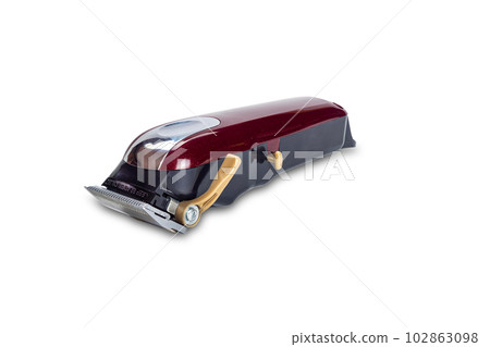Side view of single red electric hairclipper equipment for men haircut isolated on white background. 102863098