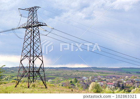 Steel pillar with high voltage electric power lines delivering electrical energy through cable wires on long distance Steel pillar with high voltage electric power lines delivering electrical energy through cable wires on long distance 102863321
