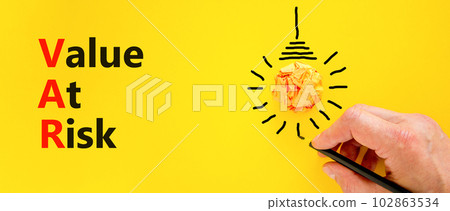 VAR Value at risk symbol. Concept words VAR Value at risk on beautiful yellow paper. Light bulb icon. Beautiful yellow table yellow background. Business and VAR Value at risk concept. Copy space. VAR Value at risk symbol. Concept words VAR Value at risk on beautiful yellow paper. Light bulb icon. Beautiful yellow table yellow background. Business and VAR Value at risk concept. Copy space. 102863534
