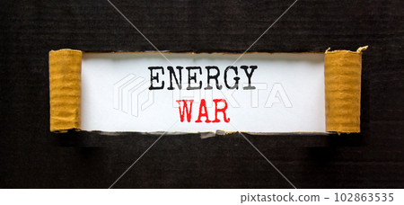 Energy war symbol. Concept words Energy war on beautiful white paper. Beautiful black paper cardboard background. Business and Energy war concept. Copy space. Energy war symbol. Concept words Energy war on beautiful white paper. Beautiful black paper cardboard background. Business and Energy war concept. Copy space. 102863535