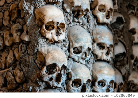 Skulls on the wall of Capela dos Ossos or Chapel of Bones in Evora 102863849