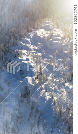 Snow Covered Mountain Tops in Canadian Nature Landscape. Aerial Snow Covered Mountain Tops in Canadian Nature Landscape. Aerial 102865741