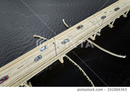 Barron Collier Bridge and Gilchrist Bridge in Florida with moving traffic. Transportation infrastructure in Charlotte County connecting Punta Gorda and Port Charlotte over Peace River Barron Collier Bridge and Gilchrist Bridge in Florida with moving traffic. Transportation infrastructure in Charlotte County connecting Punta Gorda and Port Charlotte over Peace River 102866363