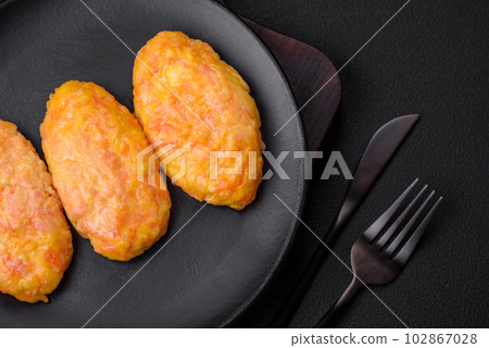 Delicious steam cutlets with carrots, cheese, salt and spices 102867028