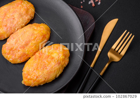 Delicious steam cutlets with carrots, cheese, salt and spices Delicious steam cutlets with carrots, cheese, salt and spices 102867029