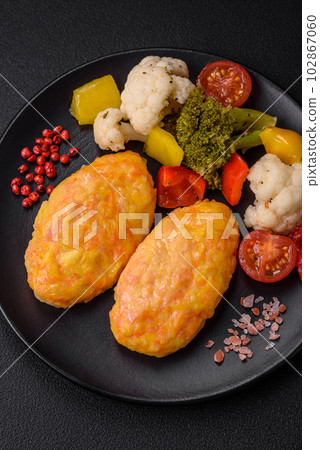 Delicious steam cutlets with carrots, cheese, salt and spices Delicious steam cutlets with carrots, cheese, salt and spices 102867060