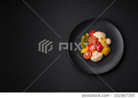 Delicious fresh salad of broccoli, cauliflower, sweet peppers and cherry tomatoes 102867105