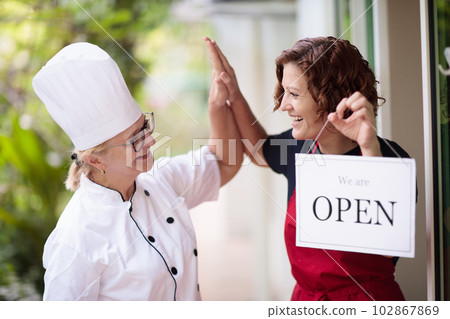 Cafe opening on first day. Open door sign. Cafe opening on first day. Open door sign. 102867869